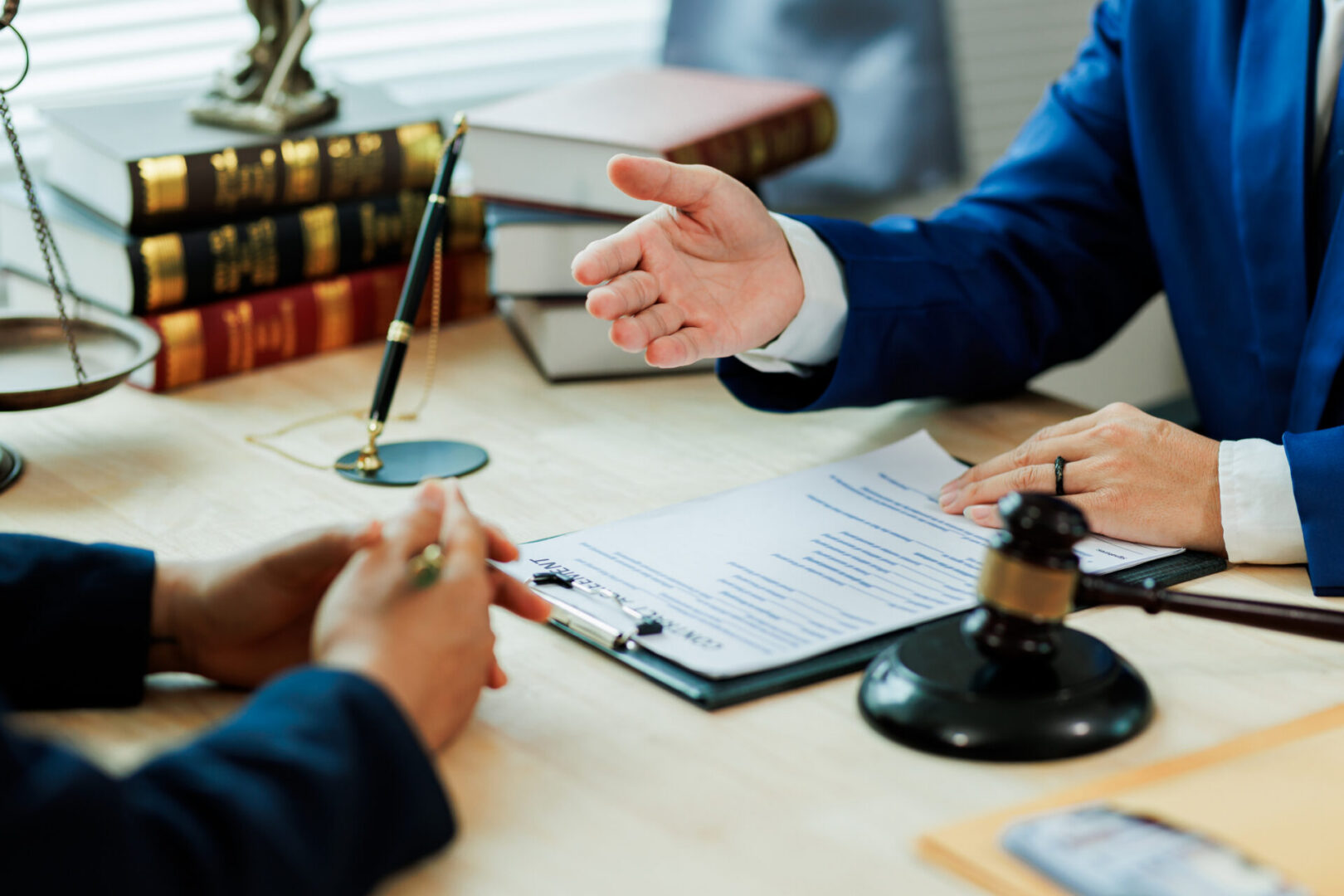 A client meets with a lawyer to discuss a legal case and seek professional representation for upcoming court proceedings.