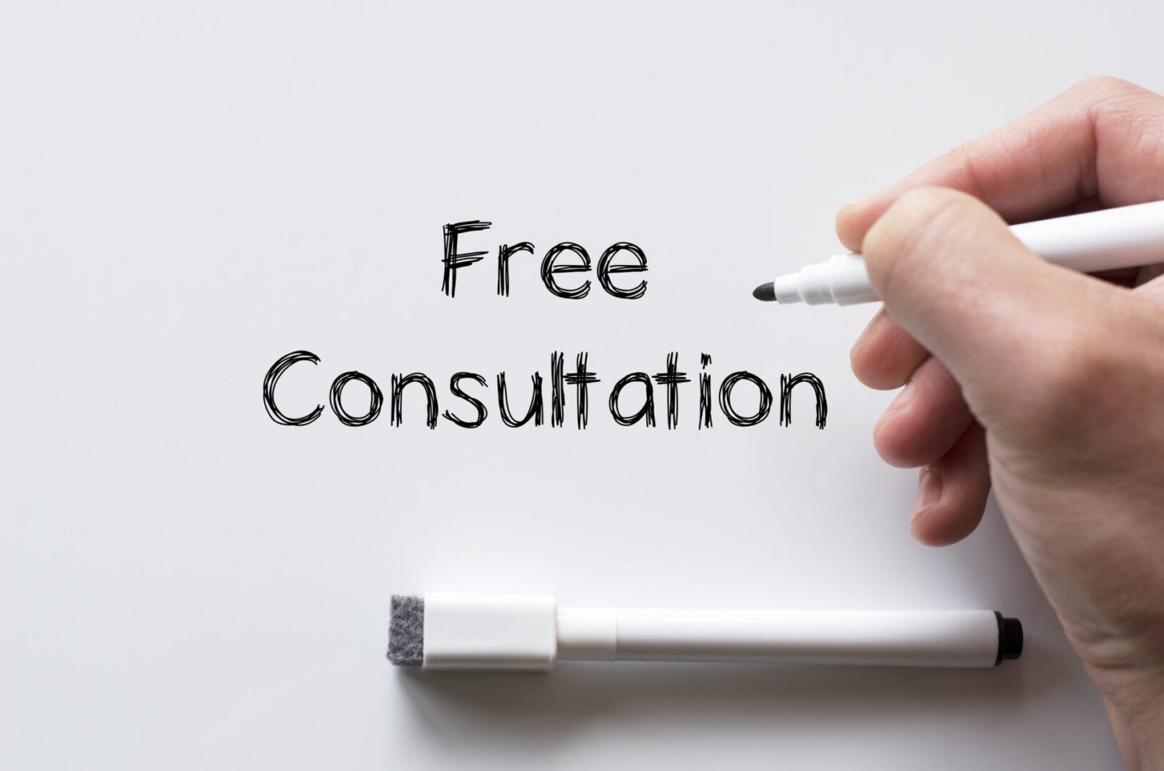 Human hand writing free consultation on whiteboard